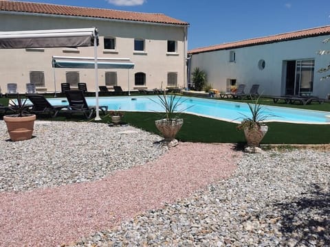 Seasonal outdoor pool, open 1:00 PM to 9:30 PM, pool umbrellas