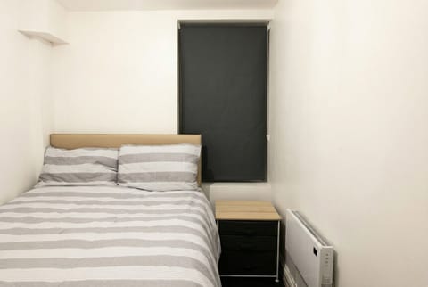 Cosy double bedroom with blackout blind for a restful night`s sleep.