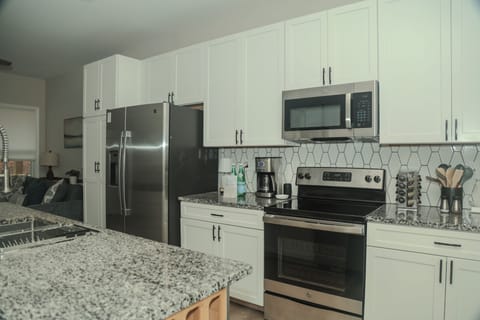 From morning coffee to family dinners, this thoughtfully appointed kitchen offers everything you need. Cook with ease, serve in style, and gather around the island with seating and dishware curated for eight guests.