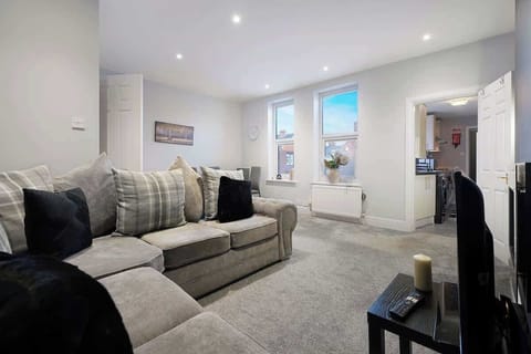 Bright and comfortable living area with cosy seating, natural light, and space to relax after a day exploring South Shields.