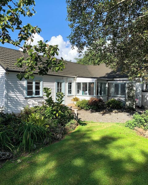 Outside view of the entrance way, set under beautiful mature trees