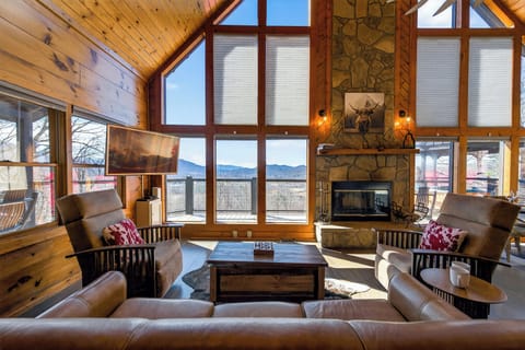 Relax in the cozy living room with comfortable seating & stunning mountain views
