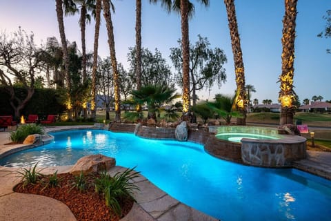 Backyard: pool and spa, natural gas fire pit with 8 chairs, natural gas fire pit, (2) sun loungers with a patio umbrella