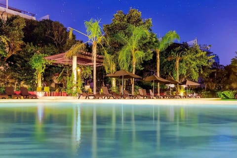 Enjoy the family infinity pool with a built-in kiddie pool, perfect for all ages. Relax on sun loungers under umbrellas, gather at the shaded pergola with outdoor furniture, use the BBQ grill, and rinse off in the outdoor showers during your stay.