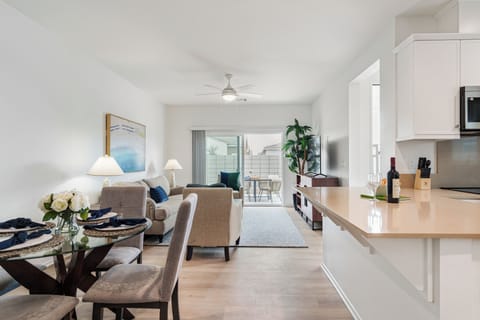 Units 2 & 5: The perfect flow for entertaining, from the kitchen island to the sunny patio.