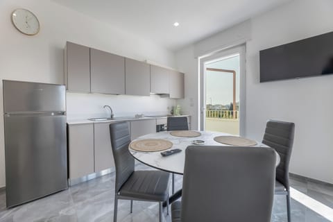 Apartment, Balcony | Private kitchen | Full-size fridge, oven, stovetop, dishwasher