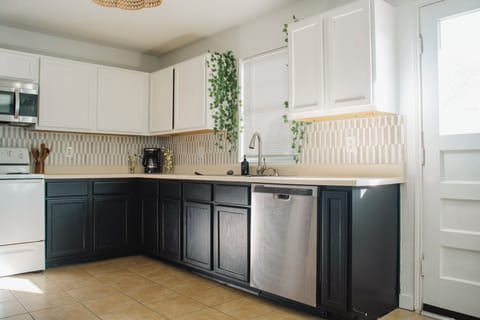 A stocked kitchen, filled with cooking supplies and dishes ready for you