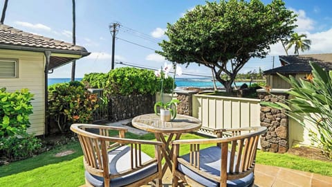 Sip your morning coffee at this charming outdoor dining set, where ocean breezes and stunning sea views create the perfect backdrop for your island getaway.