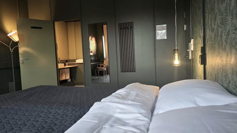 Double Room, 1 King Bed, City View, Private bathroom/shared shower | Desk, laptop workspace, blackout drapes, bed sheets