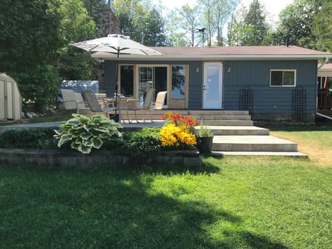 The front of the north camp with patio (great view of the lake)