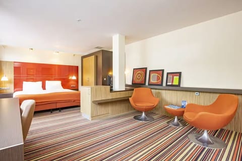 Relax in stylish lounge chairs with room to spread out.