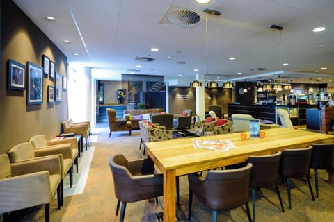 Unwind with cocktails and cozy conversation in the stylish lounge.