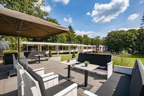 Sip cocktails on the rooftop-style terrace with open skies.
