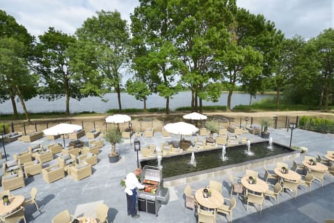 Breathe in open-air calm with expansive lakeside terrace seating.