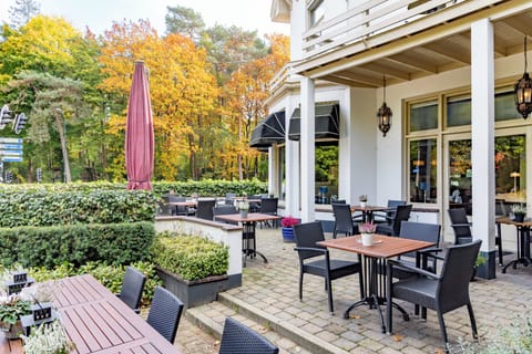 Arrive to charming outdoor seating framed by peaceful surroundings.