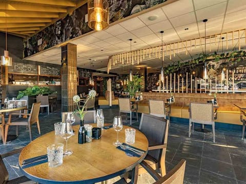 Gather for relaxed meals with chic seating and soft lighting.