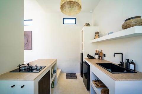 Fridge, stovetop, electric kettle, cookware/dishes/utensils