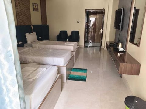 Premium Triple Room, Hill View | Desk, laptop workspace, WiFi (free)