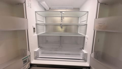 Brand-new LG refrigerator freezer with a filtered water dispenser inside. 