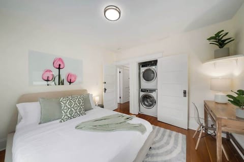 Upstairs bedroom with convenient access to laundry facilities, complete with complimentary detergent for your use. Perfect for extended stays!