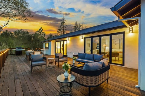 Relax in comfort on this expansive deck, where stylish seating and stunning sunset views create the perfect backdrop for unforgettable gatherings.