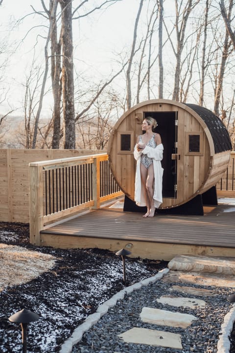 Private barrel sauna on deck with woodland views—your spa retreat.