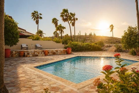 Refreshing outdoor pool perfect for swimming, relaxing, sunbathing, and enjoying tropical weather year-round.