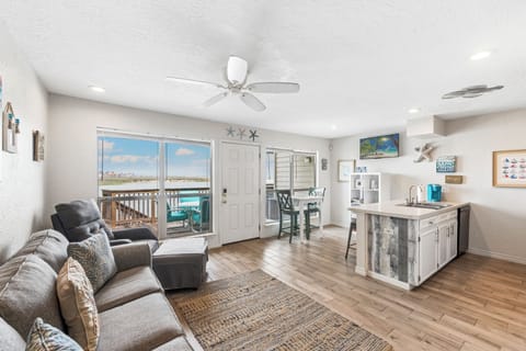 Relax in your bright, open living space with stunning water views and coastal charm throughout.