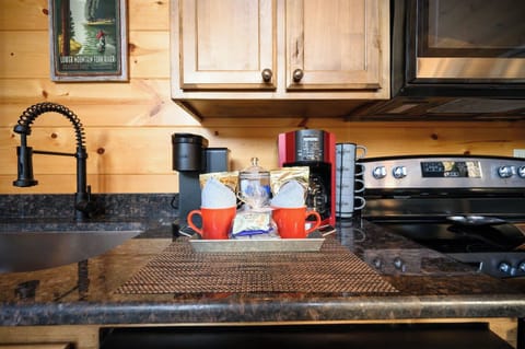 Your morning coffee awaits in this thoughtfully equipped kitchen, complete with premium appliances and charming rustic touches for memorable vacation mornings.