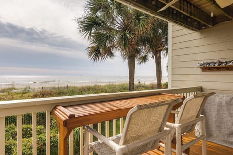Relax on your private deck while enjoying stunning ocean views and swaying palm trees.