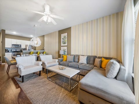 Open-concept living and dining area with modern furnishings and a cozy atmosphere.