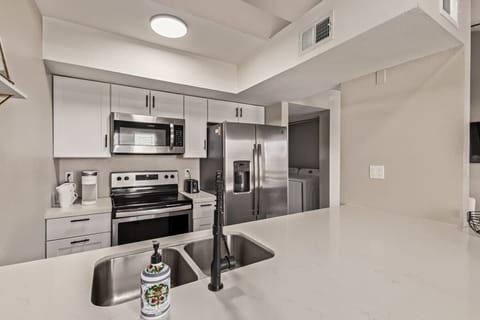 Fully stocked kitchen with modern appliances, cookware, and all essentials to prepare your favorite meals.