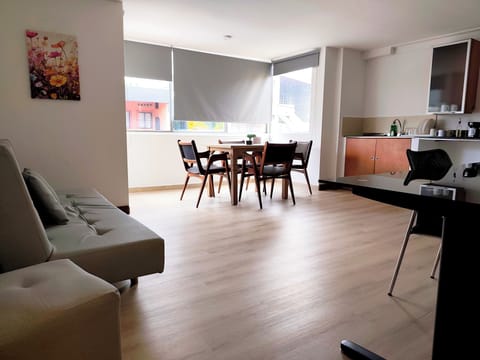 Basic Triple Room, Multiple Beds, Kitchenette | Living area | TV