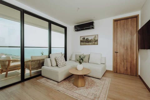 Living Room Retreat: Unwind with stunning ocean views and stylish decor in this inviting space! Turns into Twin bed. Linen provided
