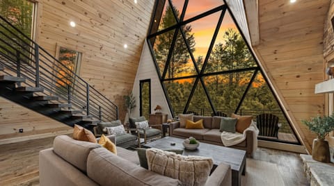 Step inside and breathe it in... soaring windows, warm wood, airy, and wrapped in natural light. The window brings the mountains to you!