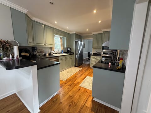 Fully equipped kitchen with ample prep space and modern appliances.