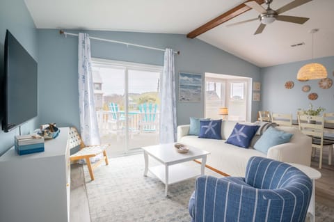 Cheerful living room with sliders to front porch