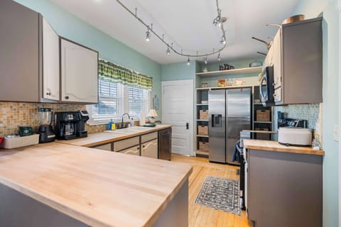 The open kitchen offers ample space & all the comforts of home