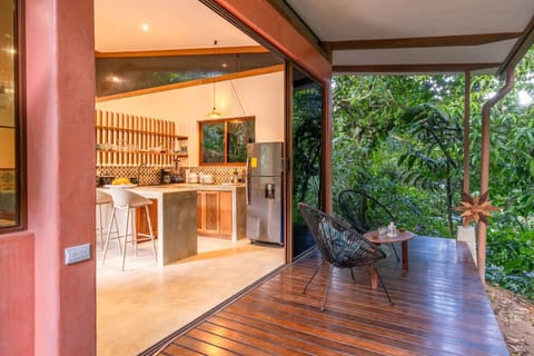 Serene terrace and kitchen blending design and nature in Puerto Viejo.
