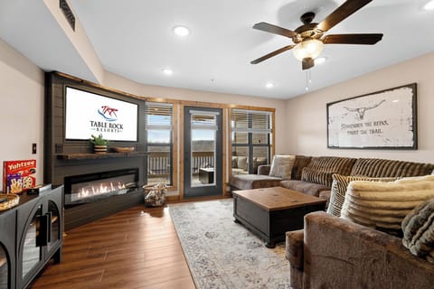Living area with Plush Sectional Sofa, Cable TV, Seasonal Fireplace, and Various Board Games
