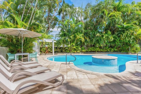 Resort style pool surrounded by greenery