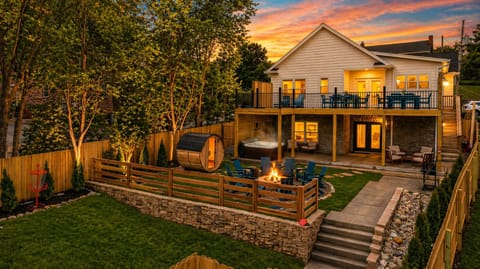 Unwind in your private backyard oasis featuring hot tub, sauna, fire pit & bbq.