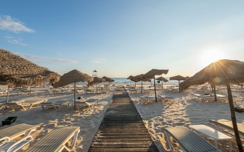 Private beach, white sand, sun loungers, beach umbrellas