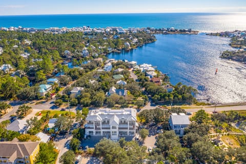 Stunning aerial view showcases this coastal property's prime location just minutes to the beach and right next to Old Florida Fish House and Beachy Bean