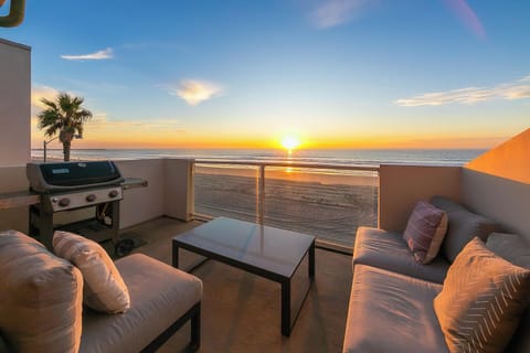 Inviting outdoor seating area with a BBQ grill, perfect for dining, entertaining, and enjoying the outdoors with family and friends.