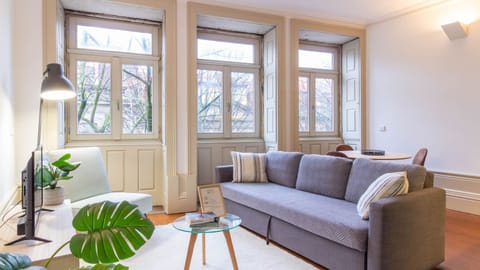 Cozy living space with lots of natural light and a comfy sofa.. #LivingRoomVibes #NaturalLight