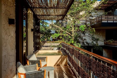 Step outside for breezy balcony lounging beneath dappled shade.