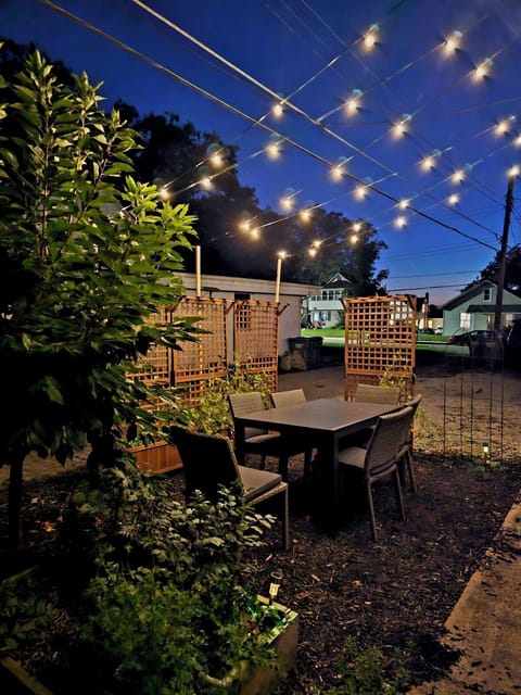 Enjoy dining under the lights in the garden.