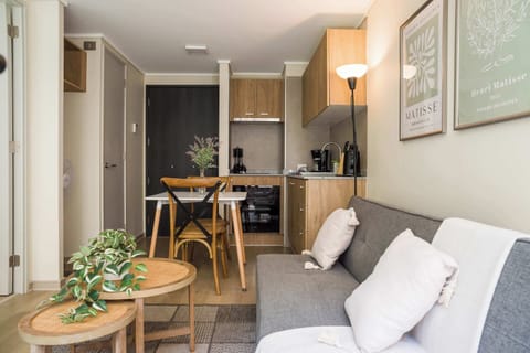 Cozy studio with modern kitchen and stylish decor, perfect for a relaxing stay in the heart of the city.