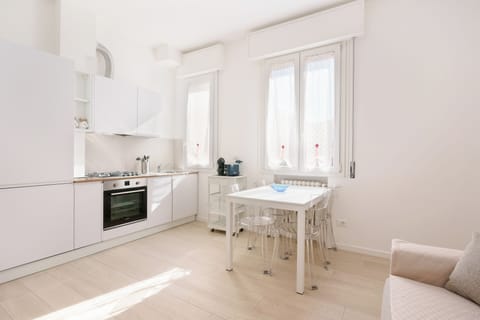 Apartment (Bilocale via cignani) | Living area | 43-inch flat-screen TV with cable channels